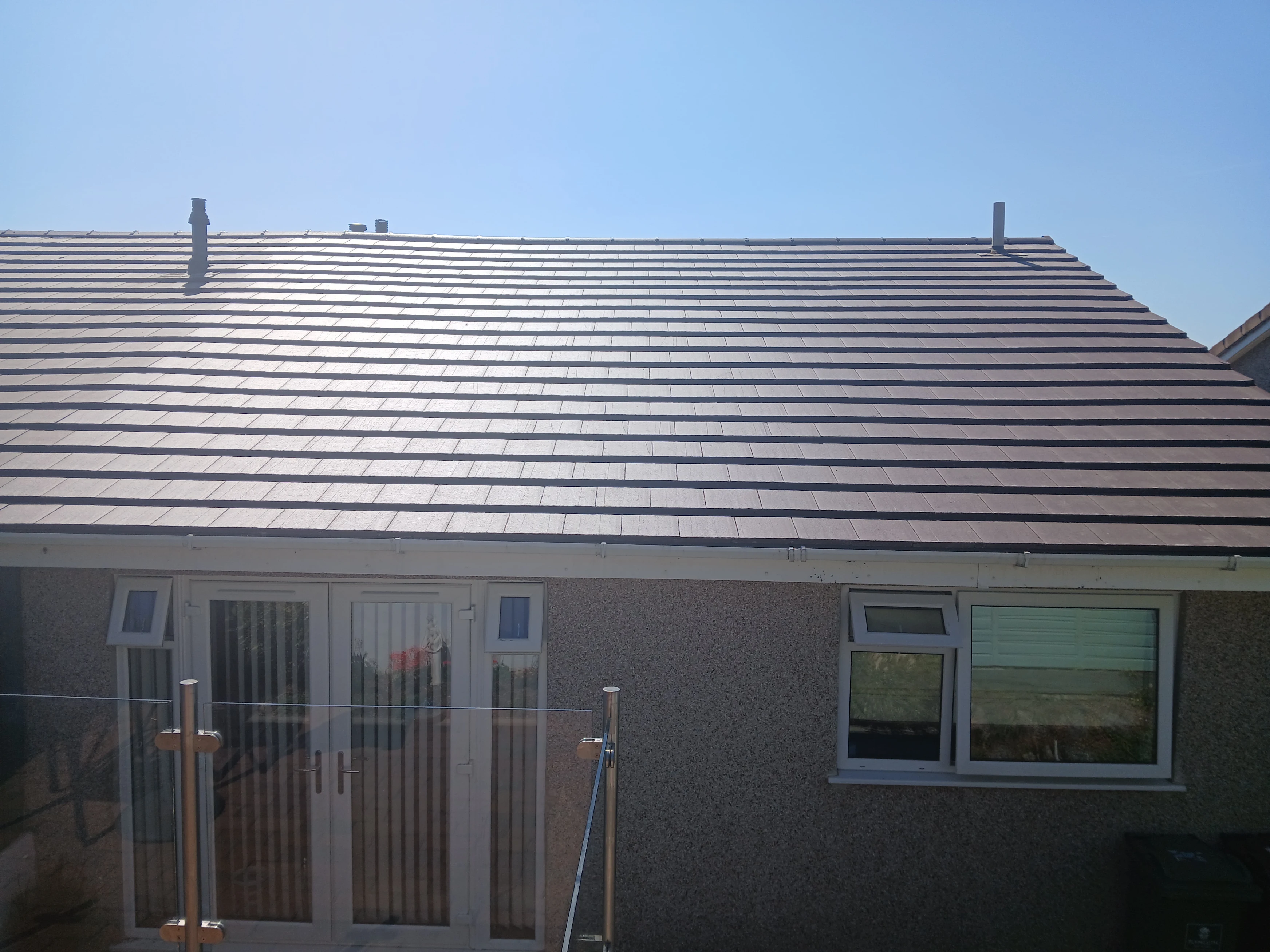 After: Roof Replacement on a Hillside Bungalow in Plympton