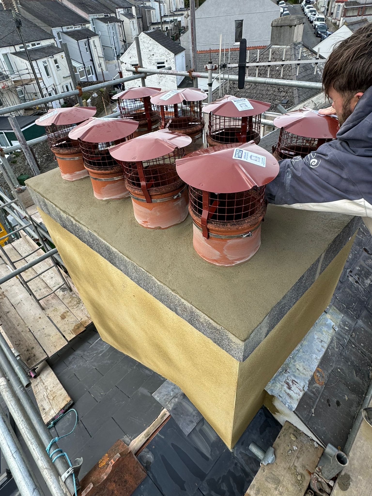 A chimney being repaired on a residential property