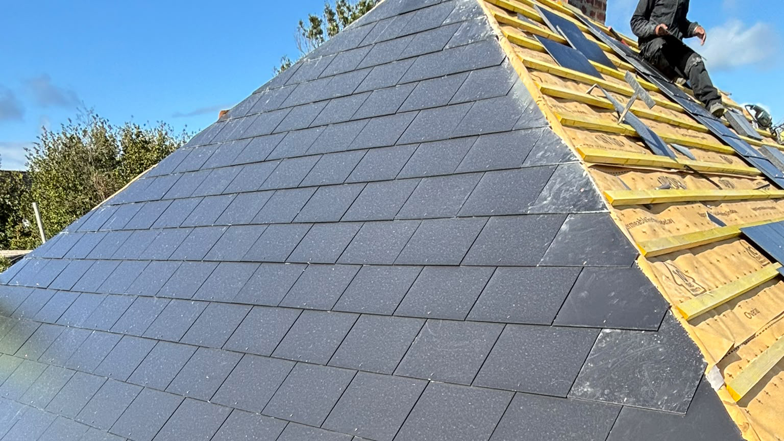 New Jutland Slates, roof battens and breathable membrane installed on a hipped bungalow roof by an expert Roofer
