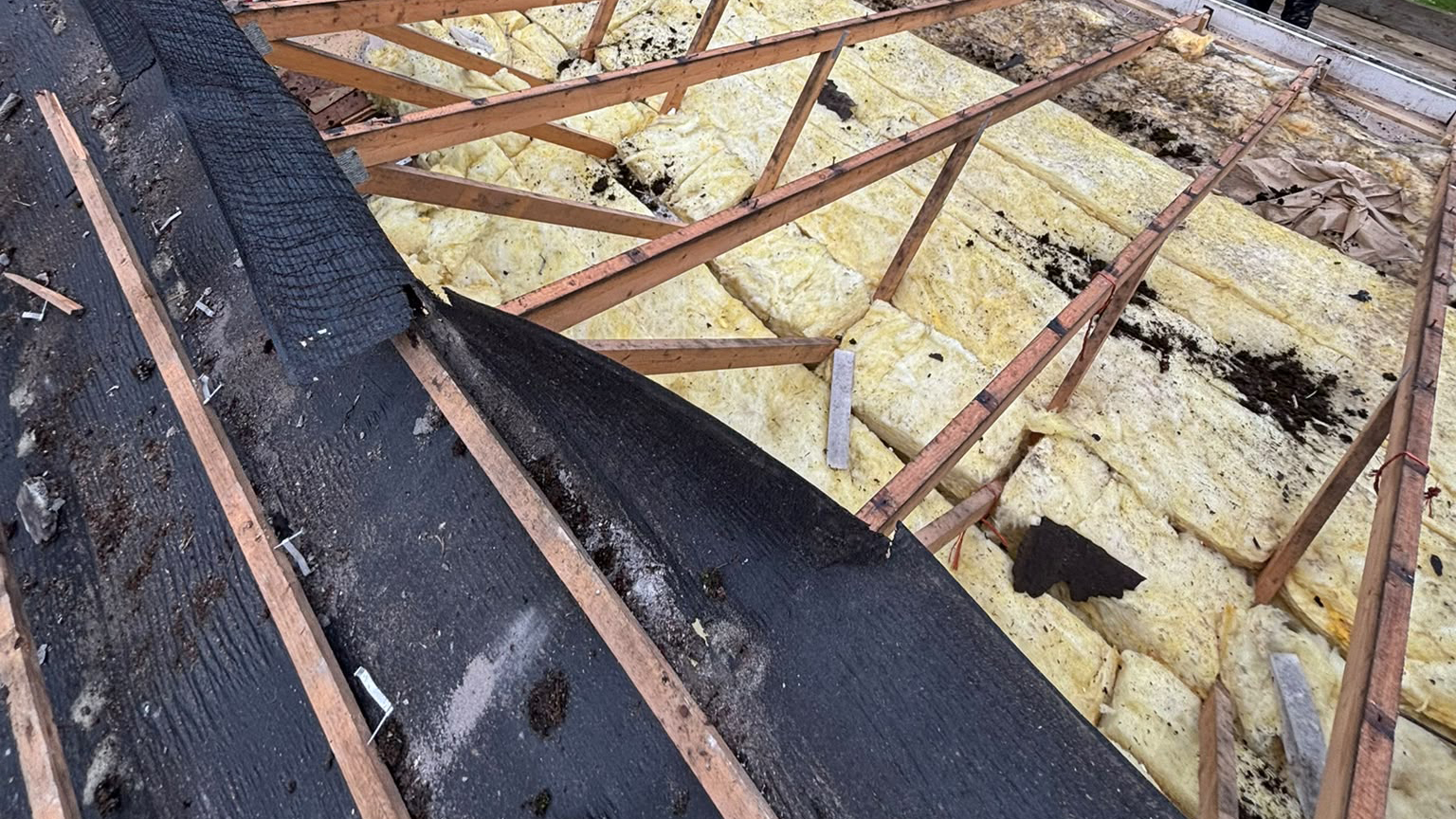 Old failing roof membrane about to be replaced by a Plymouth-based, Devon Roofer
